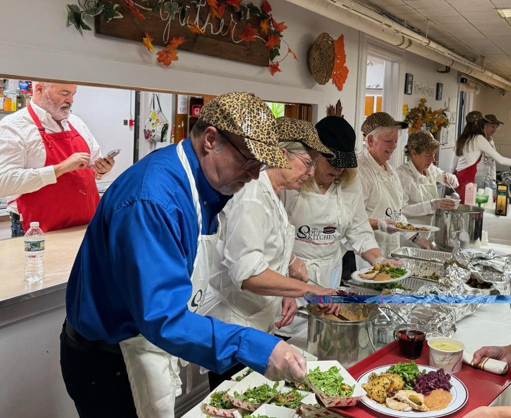 Volunteers for the Patchogue Neighbors Soup Kitchens prepare to serve hungry attendees